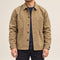 Front view of the khaki four-pocket chore coat worn over a navy shirt