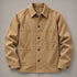 Front view of the khaki four-pocket chore coat laid flat
