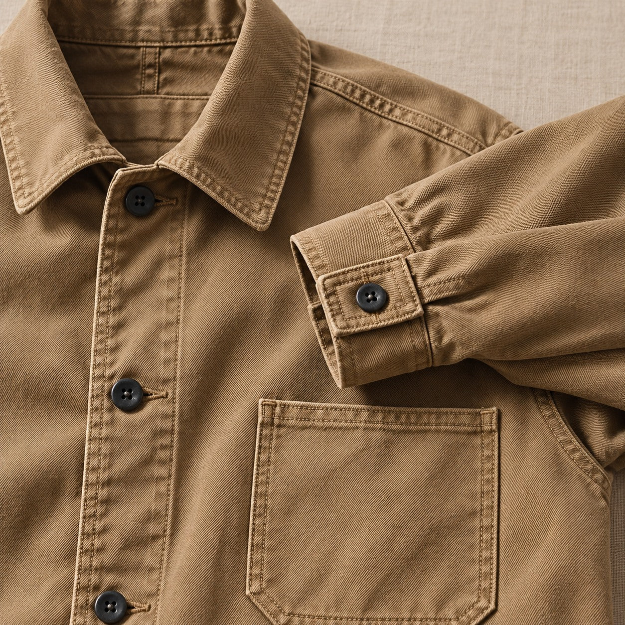 Close view of the chore coat collar, buttons, cuffs and twill texture