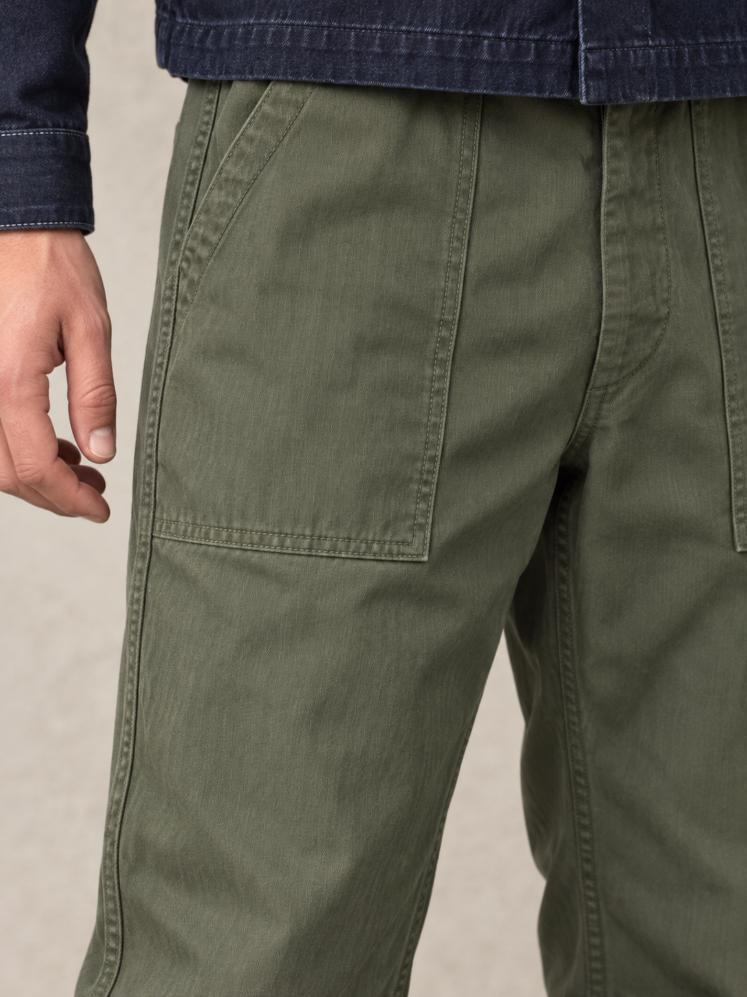 Bronson olive fatigue pants, close-up of the front patch pocket and tonal stitching