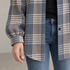 Bluehaven shacket sleeve cuff and curved front hem in blue-gray plaid