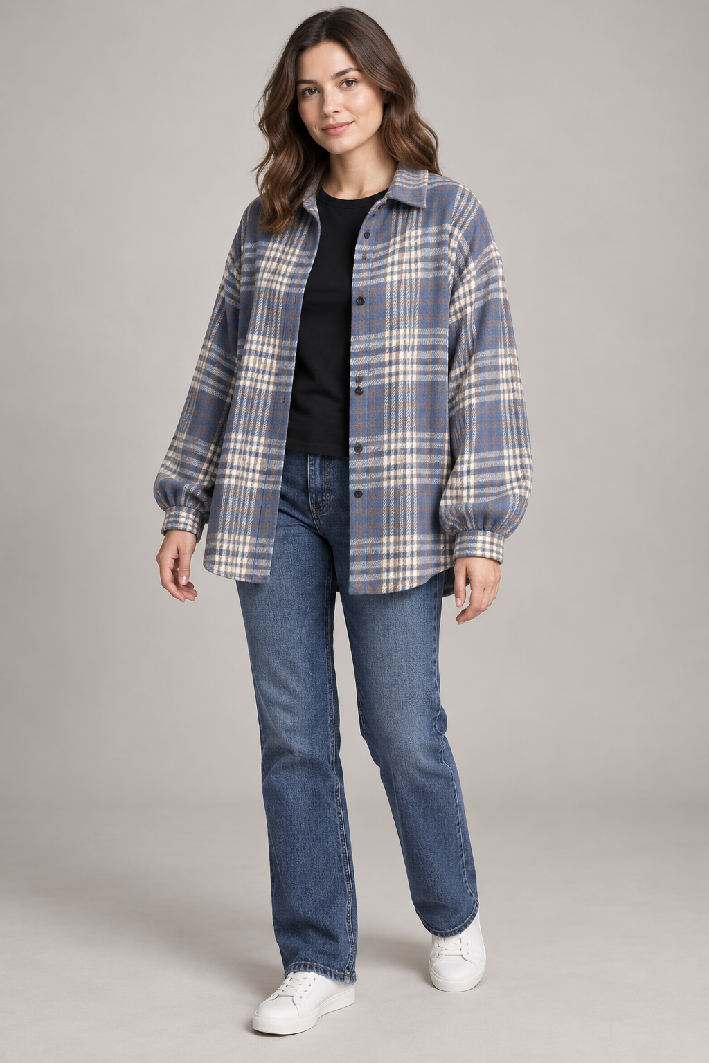 Woman wearing the Bluehaven blue-gray plaid shacket over a black tee and jeans