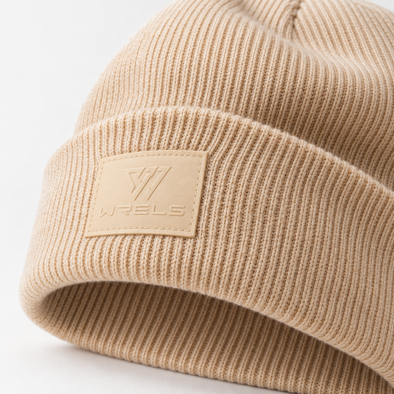 WRELS beige ribbed beanie, cuff and tonal emblem detail