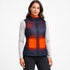 Woman wearing a heated vest with glowing orange heating elements on a white background