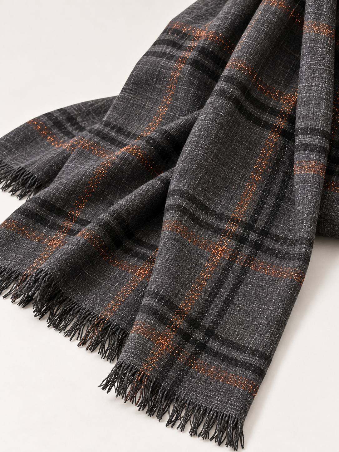 Embercheck charcoal-gray scarf, woven plaid texture and fringe detail