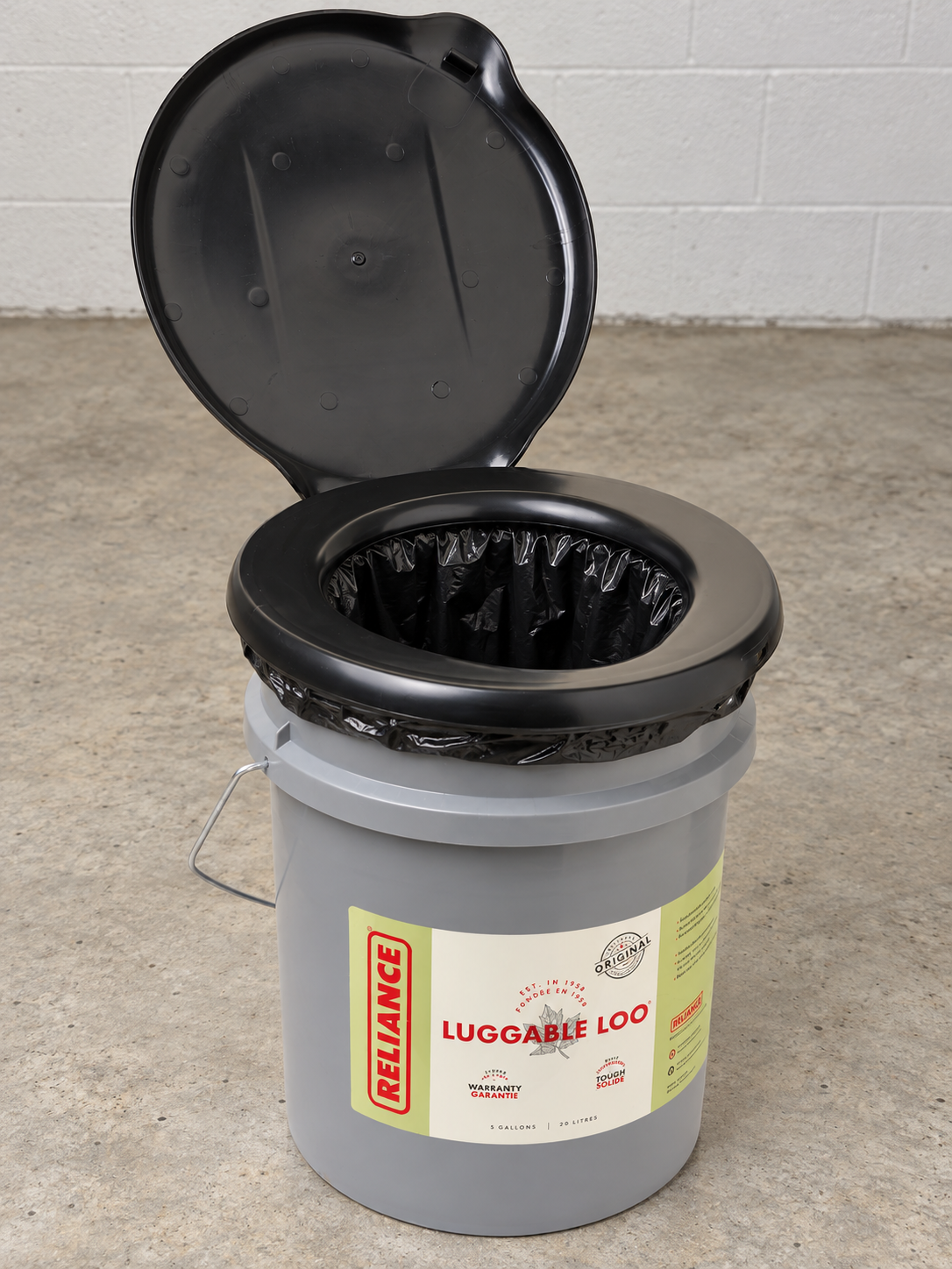 Clean Double Doodie Plus black liner fitted beneath the seat of a Reliance Luggable Loo portable toilet; toilet shown for demonstration and not included.