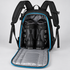 Rear compartment of the black and blue ski boot backpack open with two illustrative ski boots inside and the panel folded down; boots not included