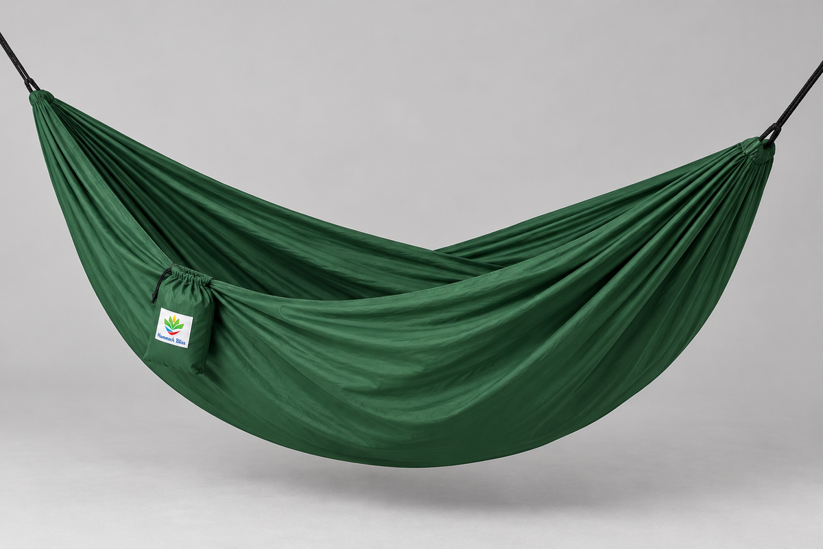 Forest Green Hammock Bliss Single hammock deployed in a supported studio view with its attached stuff sack