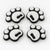 Four white pawprint snowboard stomp pads with black bases