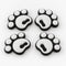 Four white pawprint snowboard stomp pads with black bases