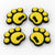 Four yellow pawprint snowboard stomp pads with black bases