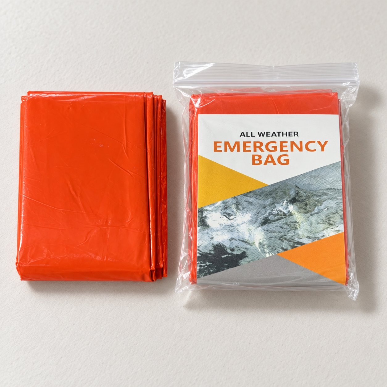 Folded orange bivy cover beside a retail-packed orange example with a printed insert, without a drawstring pouch