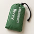 One green packed bivy cover in a drawstring pouch without a whistle