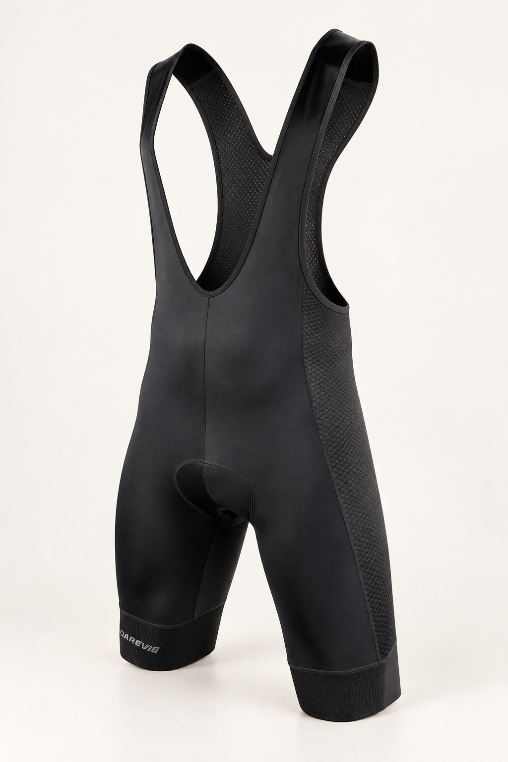 Front view of black DAREVIE DVP008 cycling bib shorts with mesh panels and broad leg bands