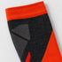 Close-up of the orange ribbed cuff and charcoal-and-gray shin knit on a Bridgedale Lightweight Alpine Ski sock.