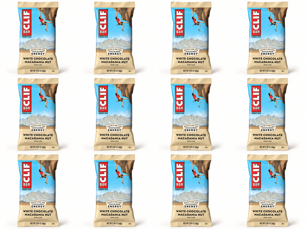 Twelve CLIF White Chocolate Macadamia bars, arranged in four columns and three rows.