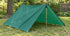 A green Equinox Egret nylon tarp in an open A-frame setup; support hardware shown for context.
