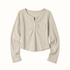 Apricot Maden ribbed cropped Henley with seven-button placket, curved hem and single chest pocket