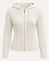 Cream cable-knit zip hoodie shown front-on in a plain studio, with a hood, drawstrings, central zip, vertical cable panels, ribbed cuffs and ribbed hem.