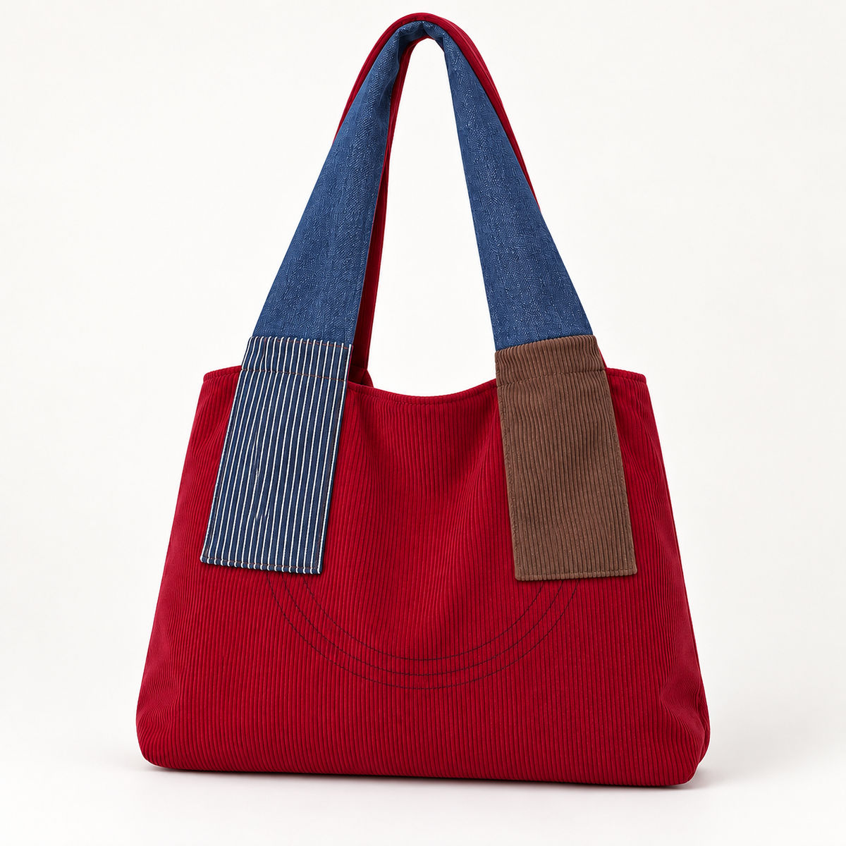 Burgundy colorblock shoulder tote with blue handles, blue pinstriped and brown front panels, and curved stitched front detail