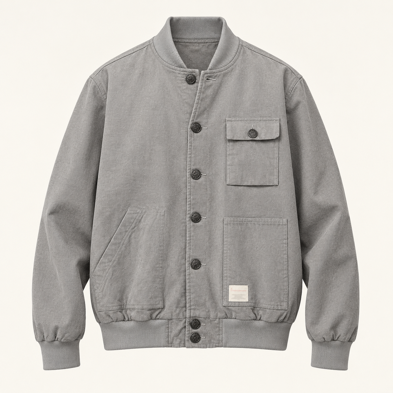 Front studio view of the gray seven-button blouson with asymmetric pockets.