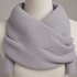 Close view of the pale-gray scarf's fine rib knit and crossed wrap.