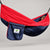 Hammock Bliss navy and red gathered-end hammock with its attached navy branded stuff sack.