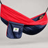 Hammock Bliss navy and red gathered-end hammock with its attached navy branded stuff sack.