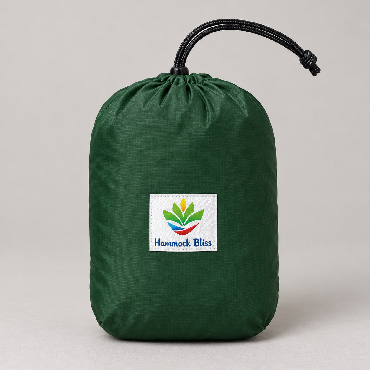 Forest-green Hammock Bliss hammock packed in its branded drawcord stuff sack.