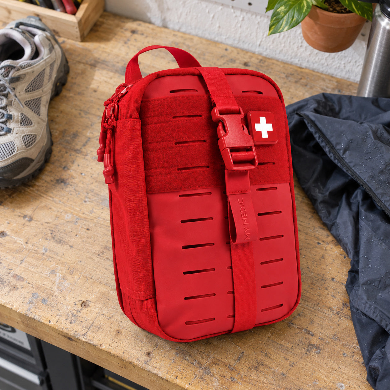 Red MyMedic MyFAK Standard kit on an ordinary home packing bench