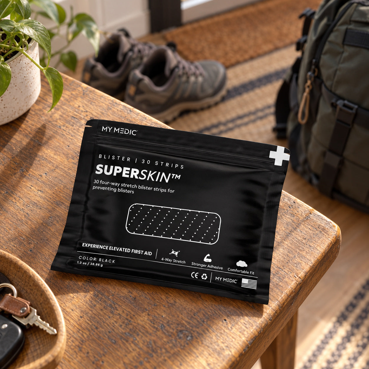 Black MyMedic SuperSkin 30-strip pouch on an ordinary home packing bench