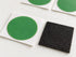 Close-up detail of a green Planet Bike patch on its backing beside the black abrading square