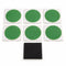 Six green Planet Bike SKAB patches on white backings with the included black abrading square