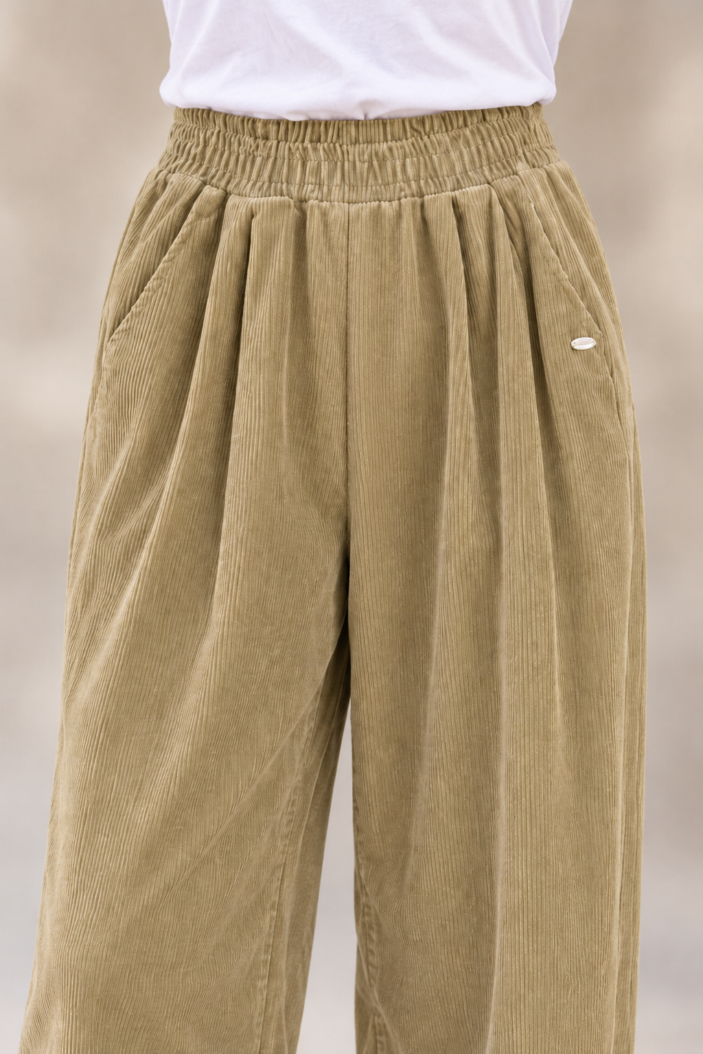 Alpex Juniper Elastic-Waist Corduroy Pants - Women's in khaki, front construction detail.