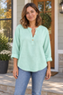 BOXDAQ Everyday Button-Neck Top - Women's in light green, worn with everyday clothing.