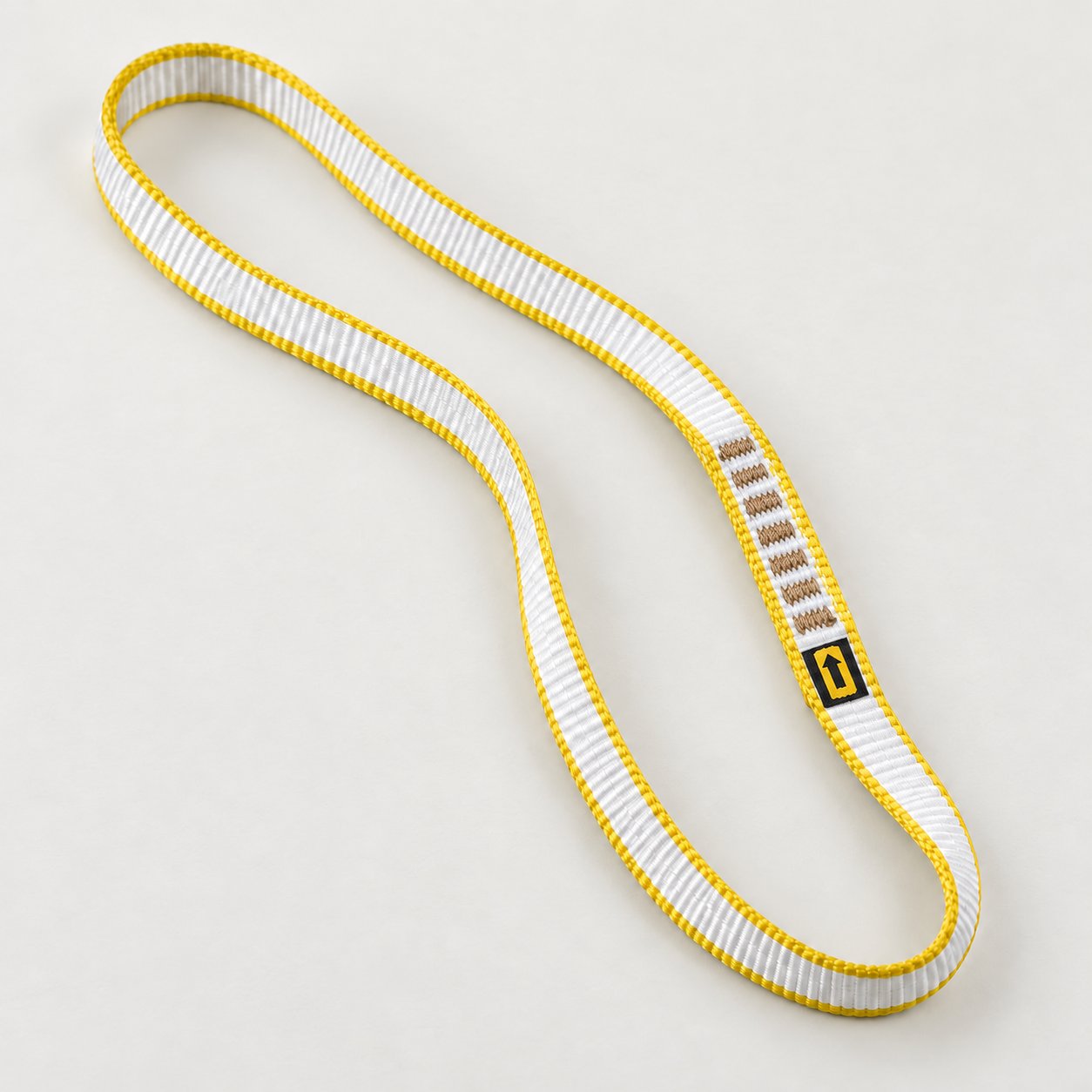 One Singing Rock 11 mm sewn loop sling with white webbing and yellow edges.