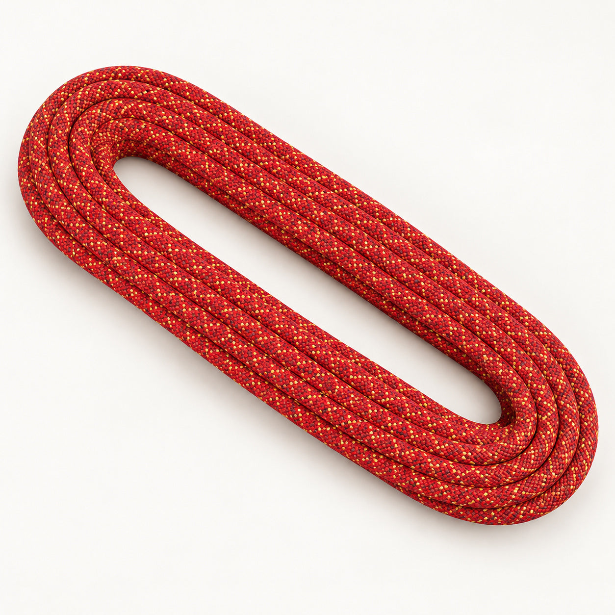 Red Singing Rock Gym 10.1 dynamic rope with yellow and dark tracers, arranged in a coil.