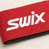 Close-up of Swix strap fabric, white branding and the black protector edge