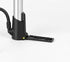 Detail of the silver Topeak Mountain Morph base, yellow pivot and narrow foot pad folded out on a studio surface.