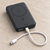 Black UGREEN PB561 magnetic power bank in a front studio view