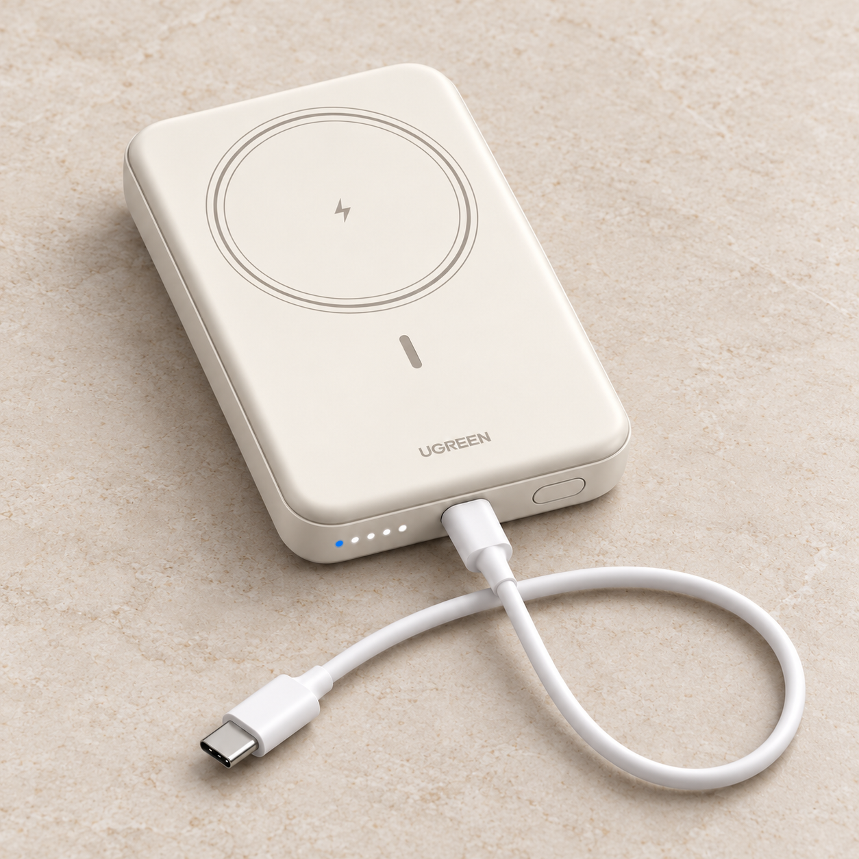White UGREEN PB561 magnetic power bank in a front studio view