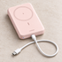 Pink UGREEN PB561 magnetic power bank in a front studio view
