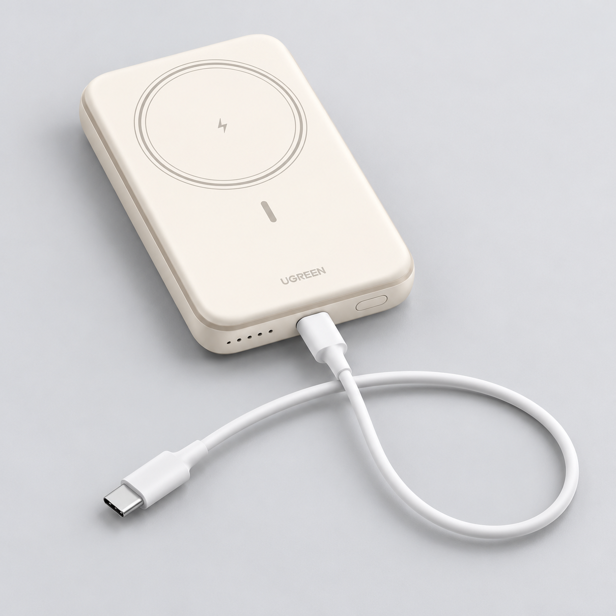 White UGREEN PB561 power bank with a USB-C-to-USB-C cable connected