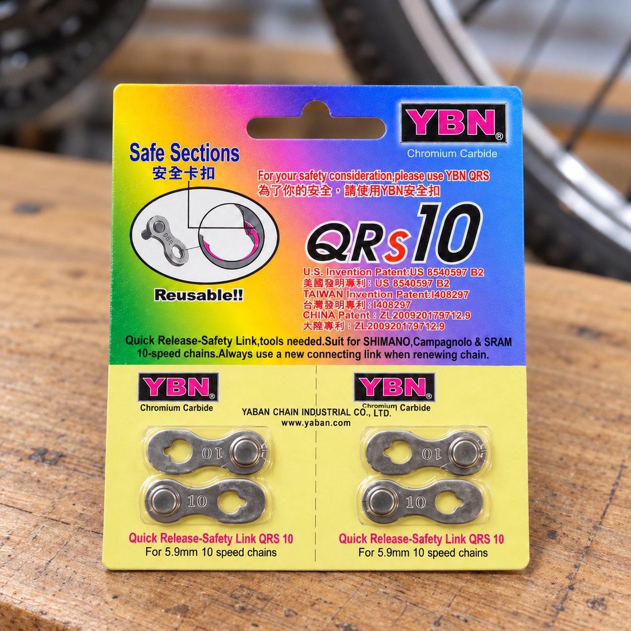 YBN QRs10 silver 10-speed two-pair quick-link pack on a bicycle workbench