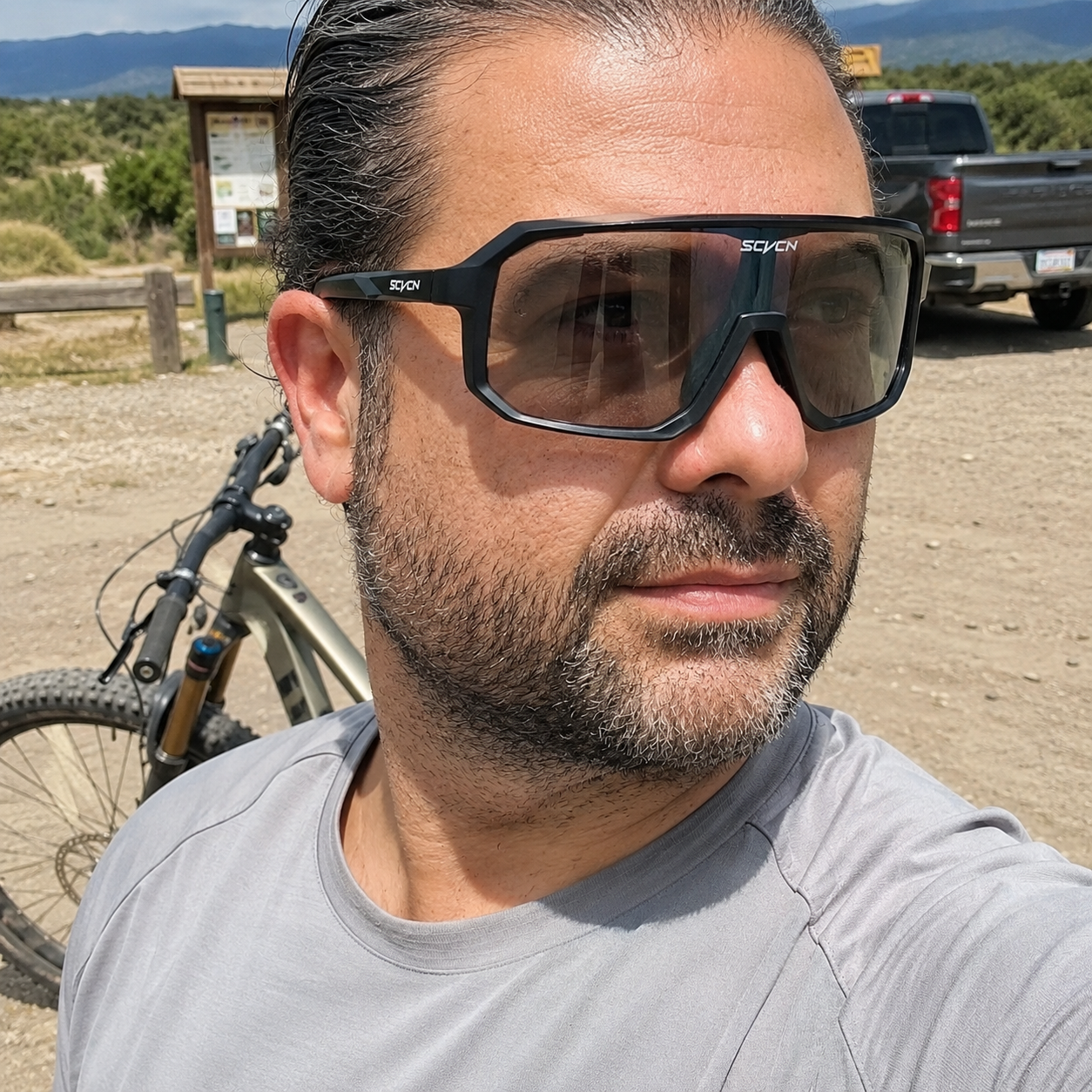 Trailhead selfie wearing Smoke ApexShift clear-to-dark cycling glasses